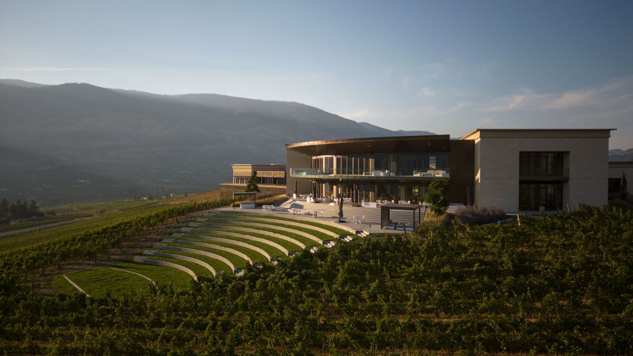 Phantom Creek Estates in the South Okanagan with vineyard, architecture, and mountain landscape