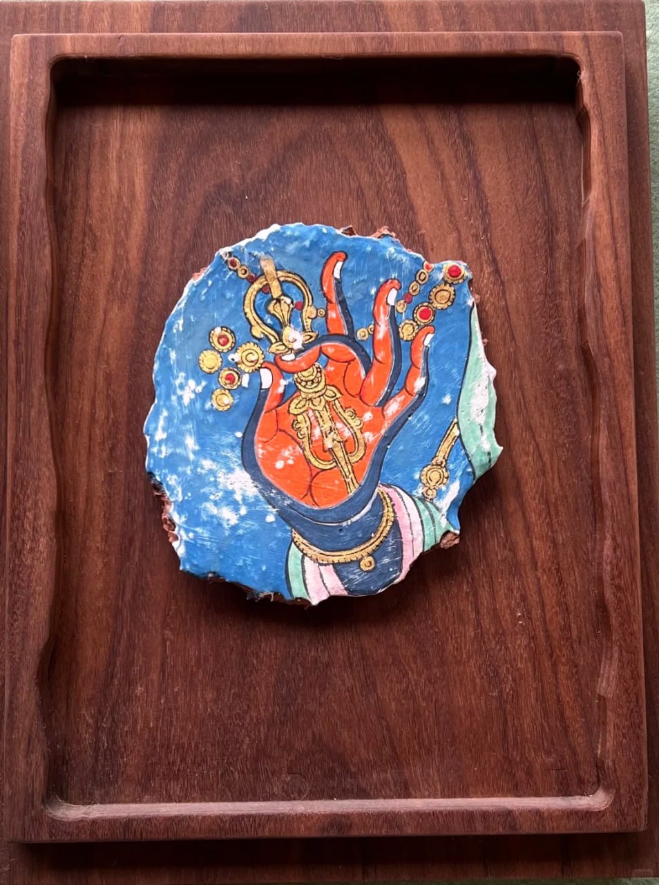 Hand of Wisdom Dunhuang-inspired artwork with symbolic red hand gesture on blue mural-fragment background